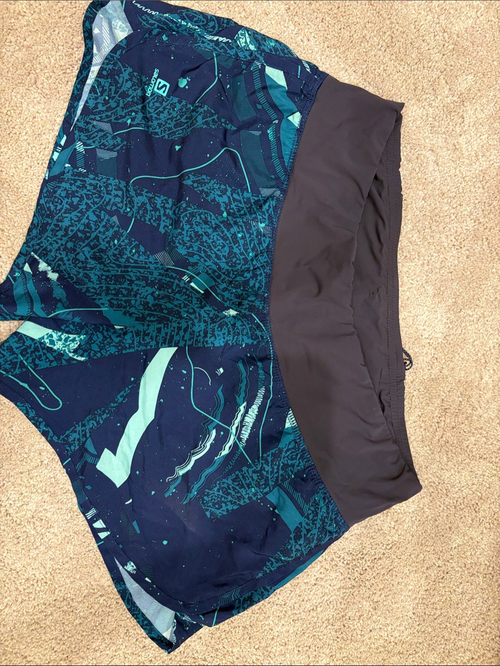 Salomon Navy and Teal Woman’s running shorts small